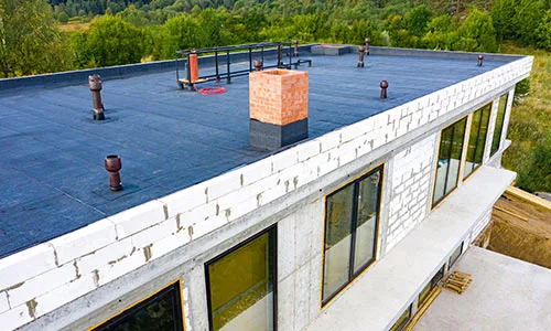 Commercial flat roofing Edmonton by Silverline Roofing Limited, showing a newly installed flat roof on a large commercial building.